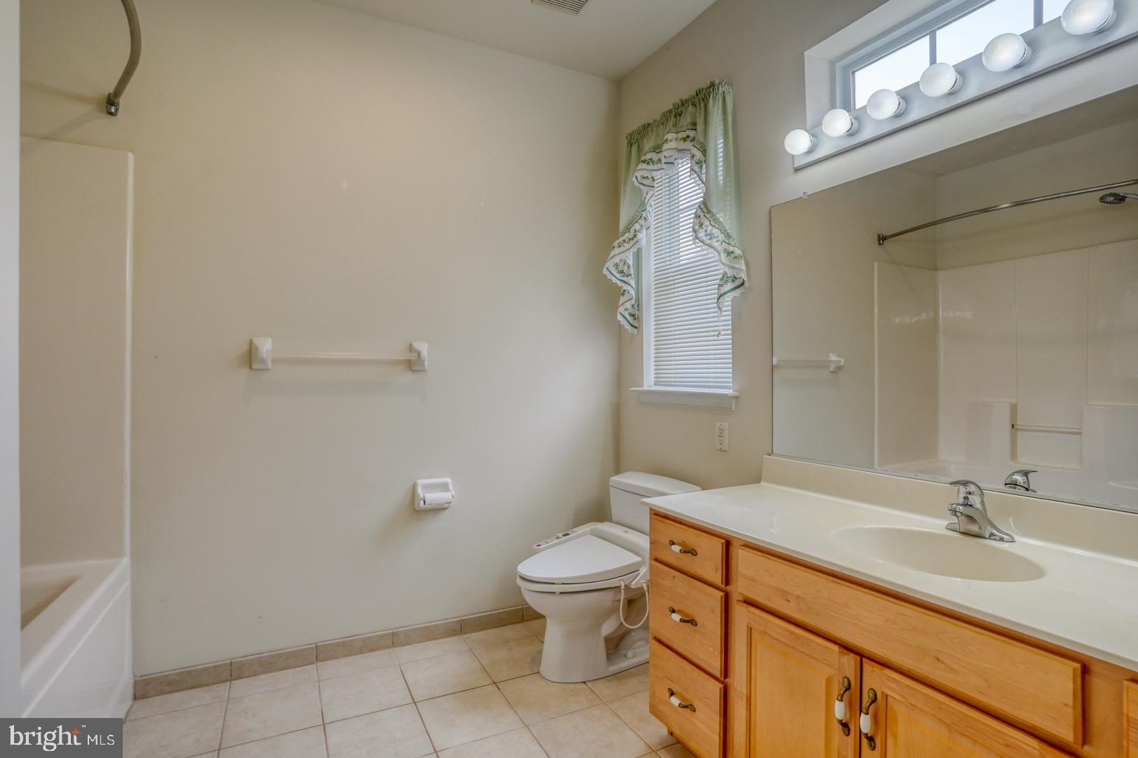 78 Springmill Drive Middletown, DE 19709 - Photo 24 of 60 a bathroom with a granite countertop sink a toilet and a mirror