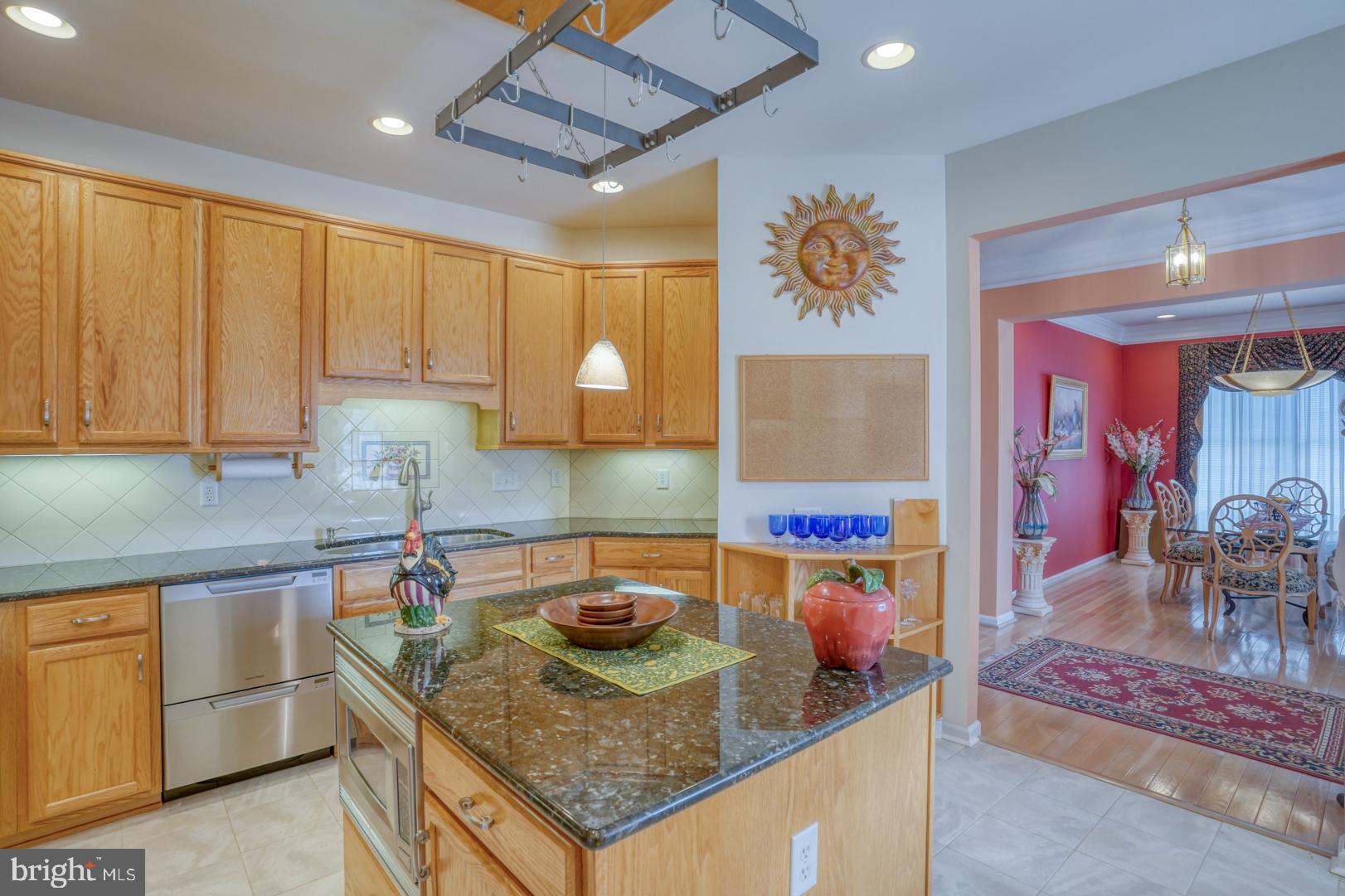 78 Springmill Drive Middletown, DE 19709 - Photo 31 of 60 a kitchen with stainless steel appliances granite countertop a sink and a cabinets