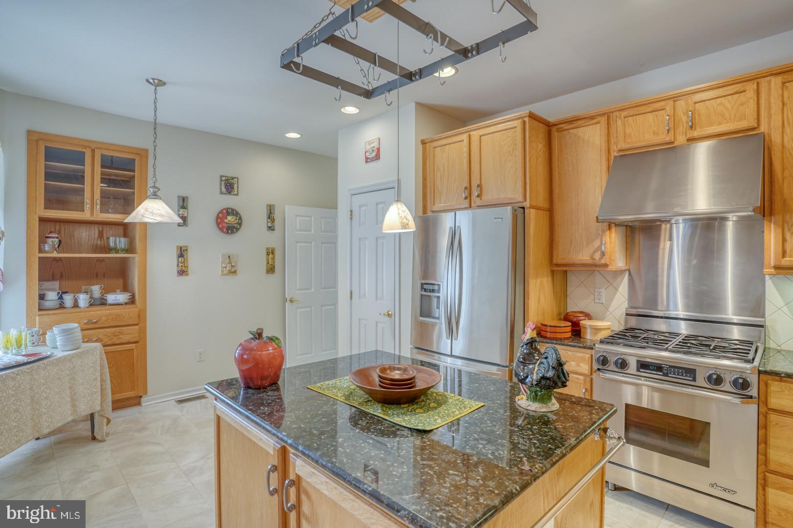 78 Springmill Drive Middletown, DE 19709 - Photo 32 of 60 a kitchen with stainless steel appliances granite countertop a sink a stove and a refrigerator
