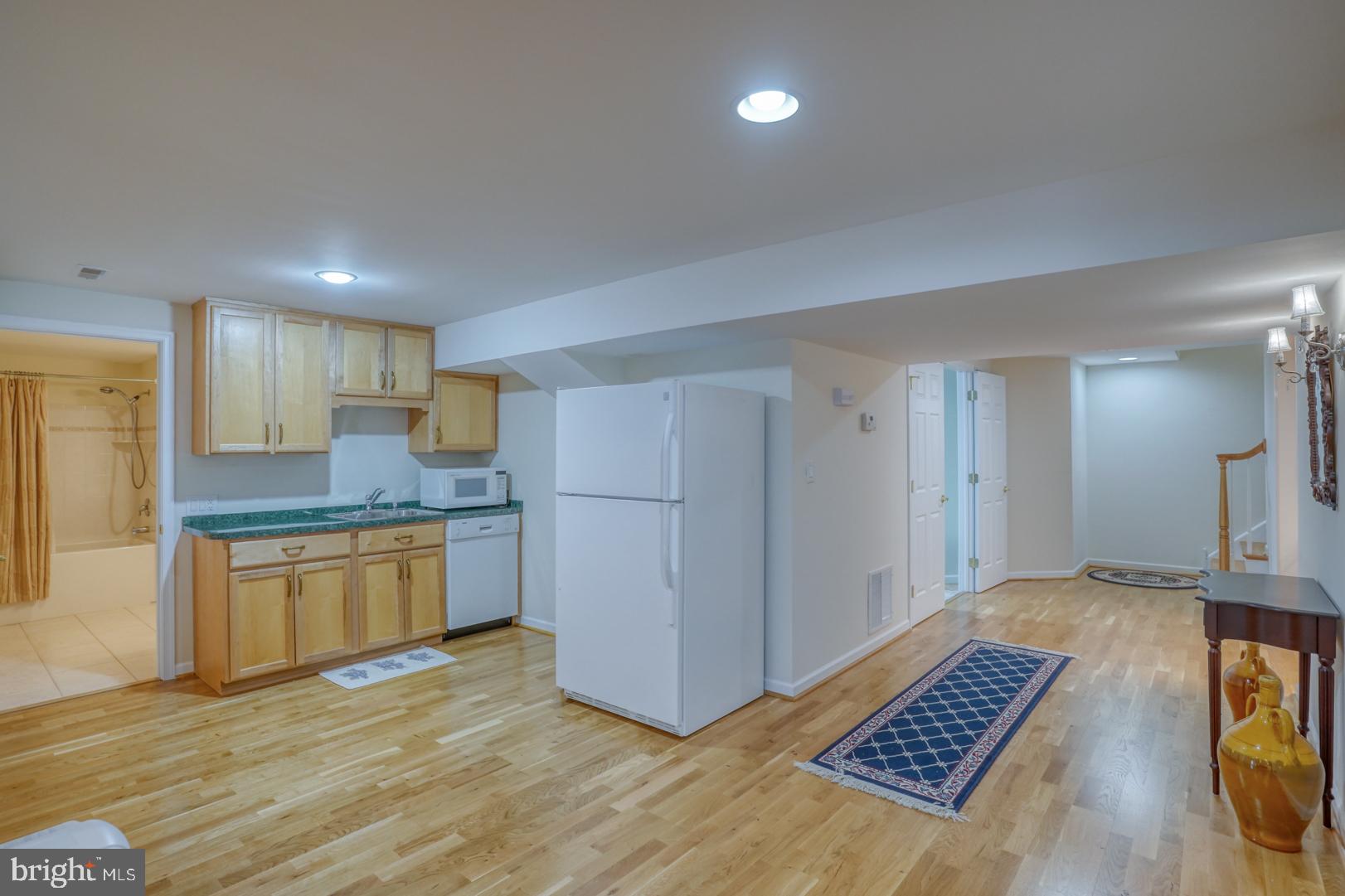 78 Springmill Drive Middletown, DE 19709 - Photo 46 of 60 a kitchen with stainless steel appliances granite countertop a refrigerator and a stove top oven