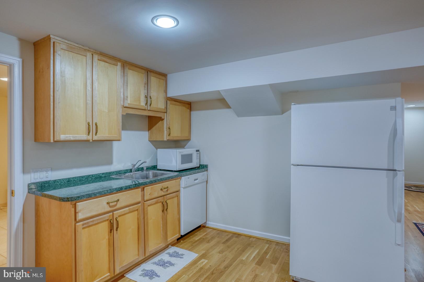 78 Springmill Drive Middletown, DE 19709 - Photo 47 of 60 a kitchen with stainless steel appliances white cabinets and a refrigerator