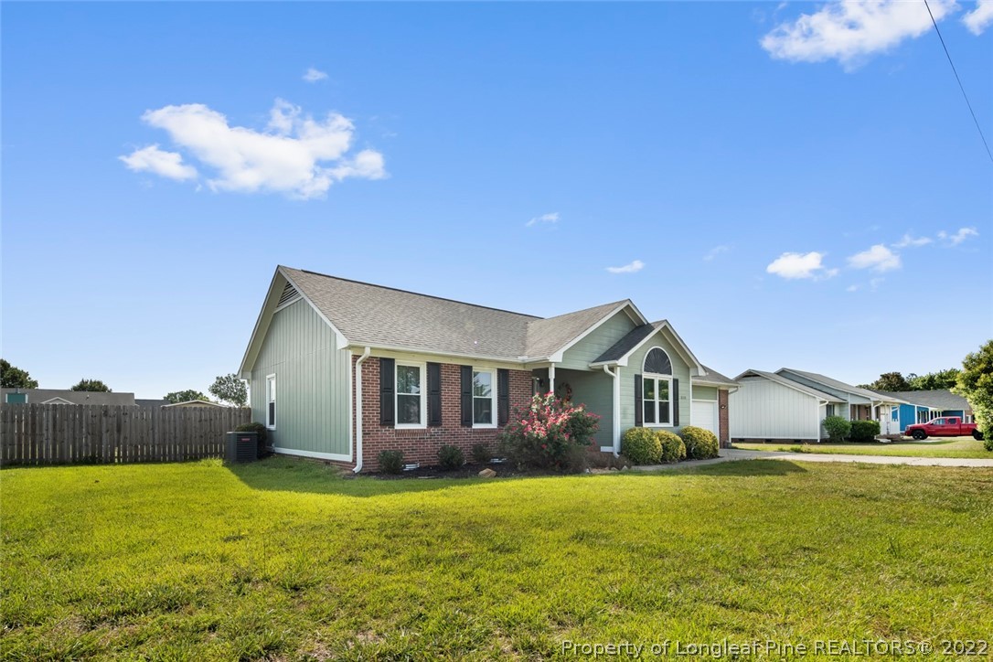 8209 Rockfish Road Raeford, NC 28376 - Photo 2 of 42 a front view of house with yard and green space