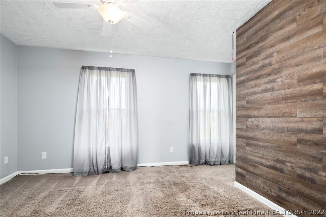 8209 Rockfish Road Raeford, NC 28376 - Photo 22 of 42 an empty room with windows
