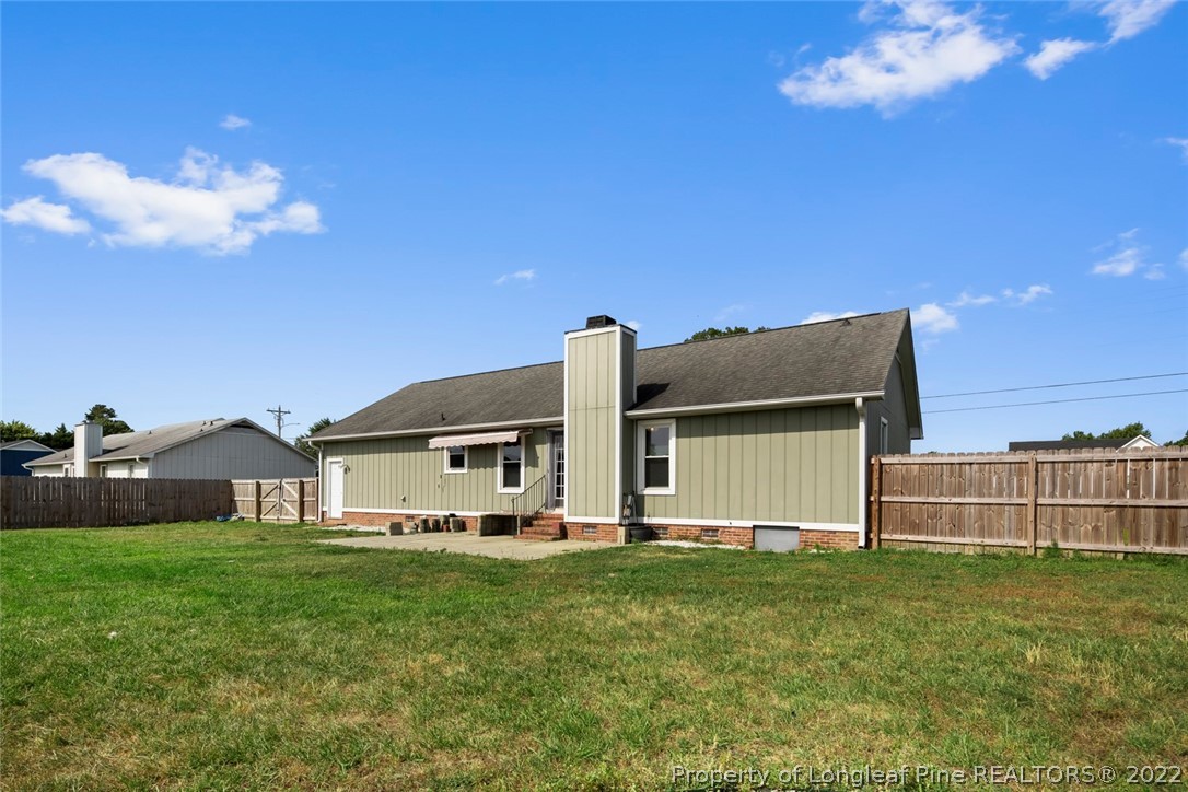 8209 Rockfish Road Raeford, NC 28376 - Photo 39 of 42 a front view of a house with garden