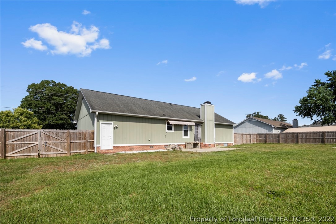 8209 Rockfish Road Raeford, NC 28376 - Photo 40 of 42 a front view of house with yard and green space