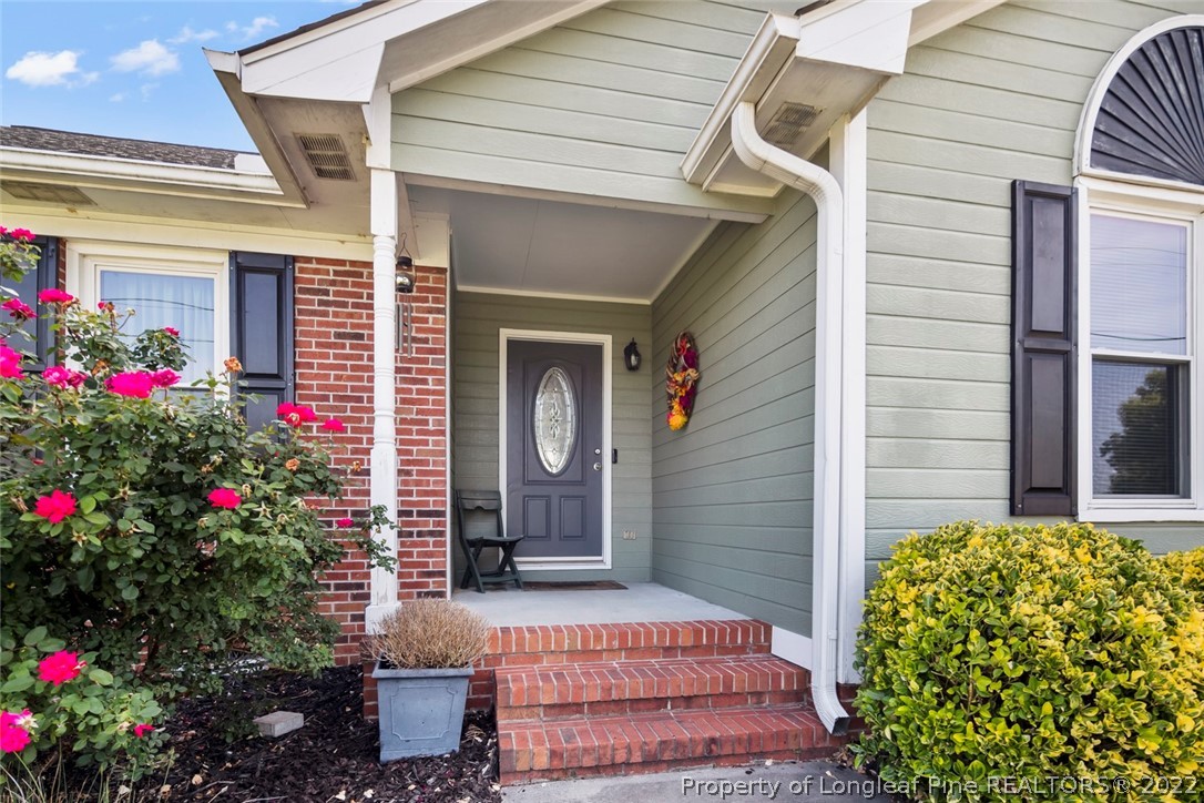8209 Rockfish Road Raeford, NC 28376 - Photo 5 of 42 a view of a porch with flowers