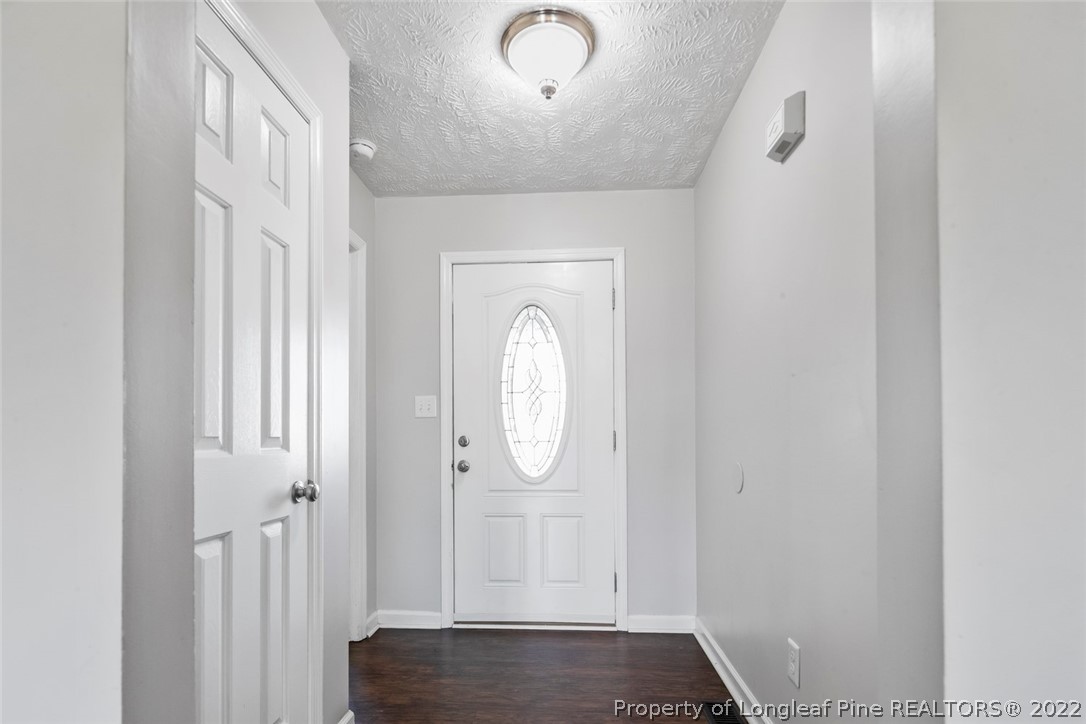 8209 Rockfish Road Raeford, NC 28376 - Photo 7 of 42 a view of a livingroom with wooden floor and a window