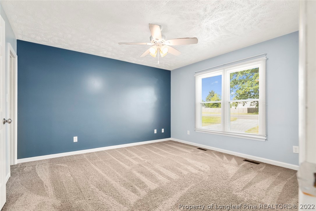 8209 Rockfish Road Raeford, NC 28376 - Photo 8 of 42 a view of an empty room with a window