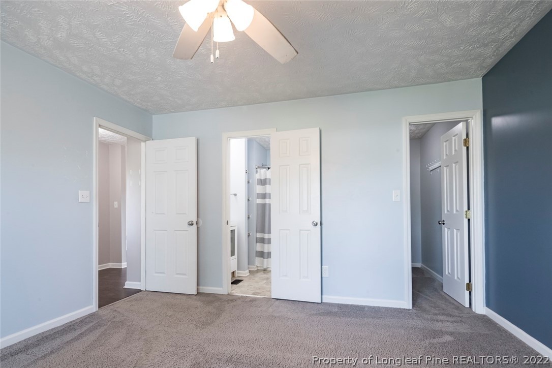 8209 Rockfish Road Raeford, NC 28376 - Photo 9 of 42 a view of an empty room and chandelier fan