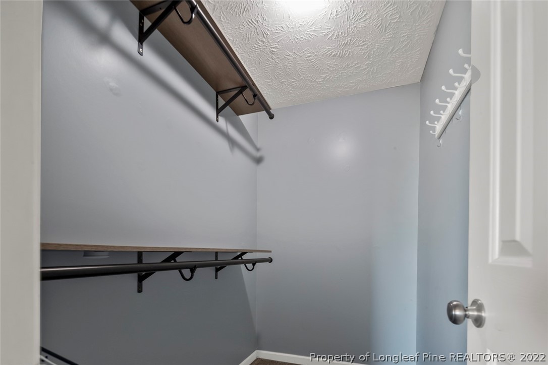 8209 Rockfish Road Raeford, NC 28376 - Photo 10 of 42 a view of a room with rack on the wall