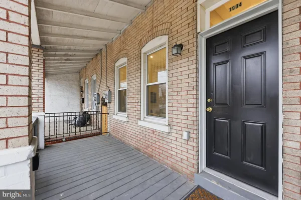 a view of a balcony with wooden floor