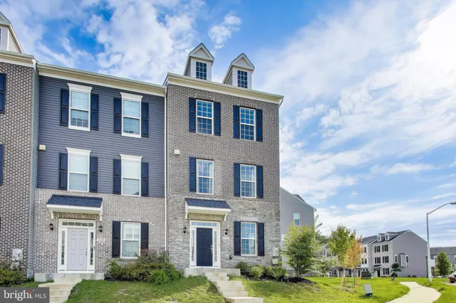 a view of a brick building next to a yard