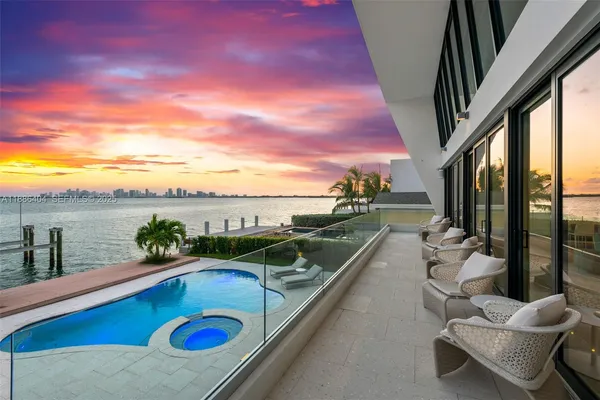 a view of swimming pool with seating space and hardwood floor