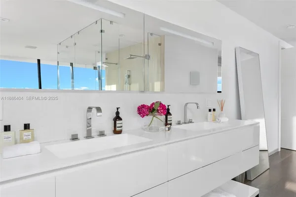 a bathroom with a sink and a mirror