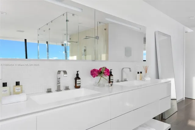 a bathroom with a sink and a shower
