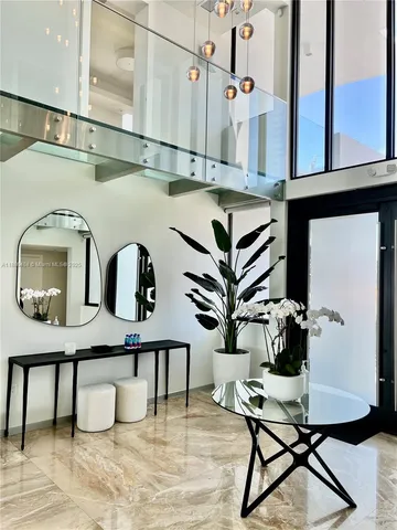 a front view of a house with outdoor seating