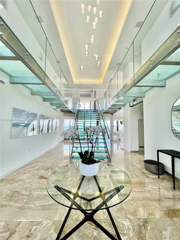 a dining room with table and chairs