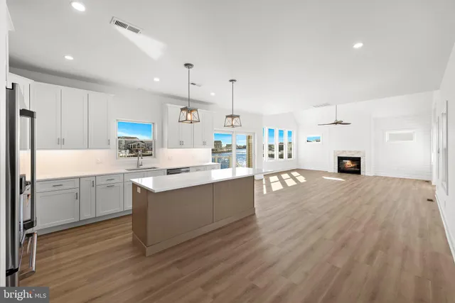 an aerial view of a house with outdoor seating