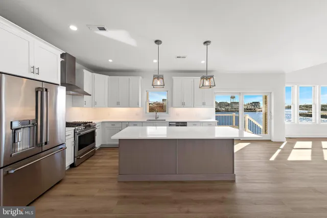 an aerial view of a city with ocean view