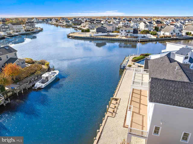 an aerial view of a house with a ocean view