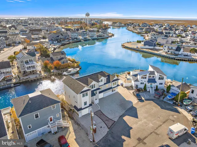 an aerial view of a city with ocean view