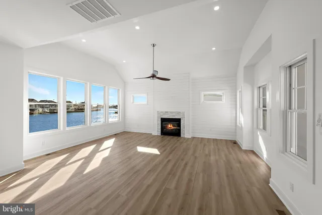 an aerial view of a house with lake view