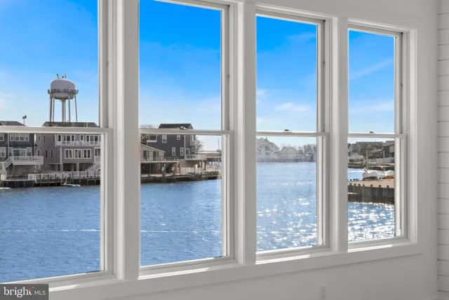 an aerial view of a house with a ocean view