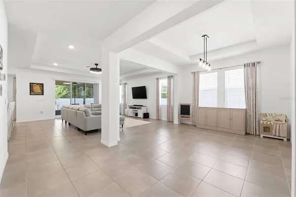 a view of a livingroom with furniture and a ceiling fan