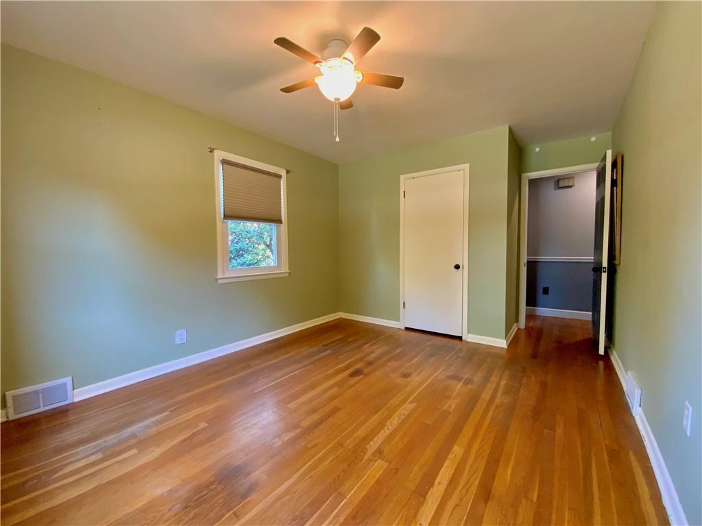 200 Chaplin Drive Coraopolis, PA 15108 - Photo 14 of 25 a view of an empty room with wooden floor and a window