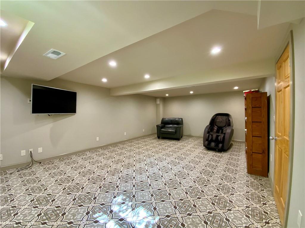 200 Chaplin Drive Coraopolis, PA 15108 - Photo 18 of 25 a large room with furniture and a flat screen tv