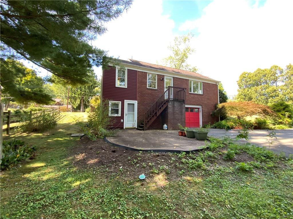 200 Chaplin Drive Coraopolis, PA 15108 - Photo 24 of 25 a view of a yard in front of a house with large trees