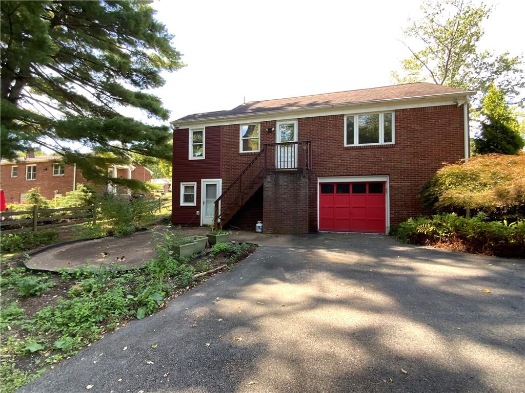 200 Chaplin Drive Coraopolis, PA 15108 - Photo 25 of 25 a front view of a house with a yard and garage
