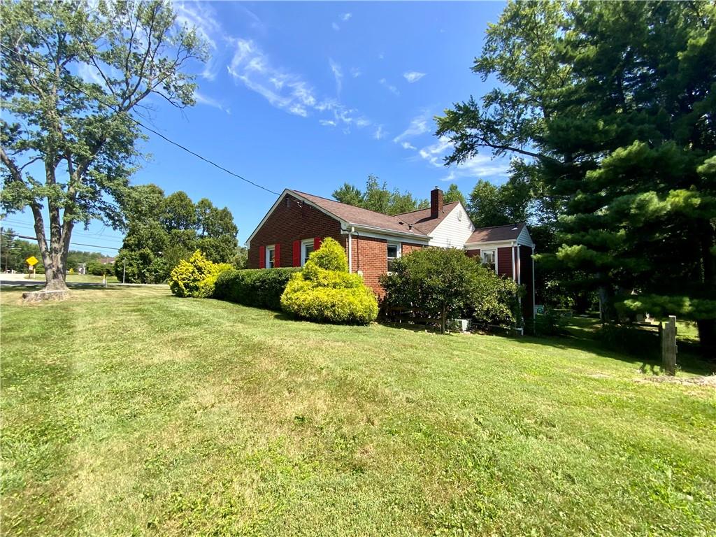 200 Chaplin Drive Coraopolis, PA 15108 - Photo 3 of 25 a front view of a house with a yard and garage