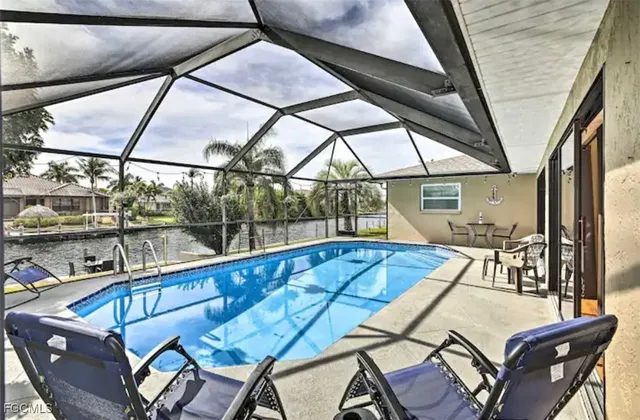a view of a swimming pool with a lounge chairs