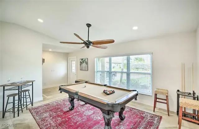 a living room with a table and a window