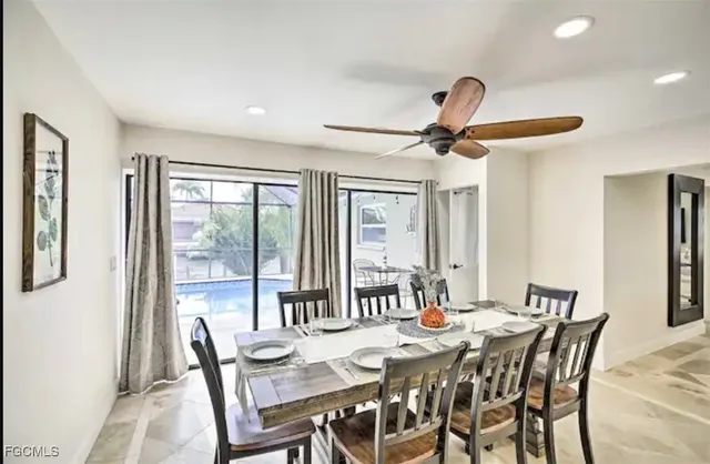 a dining room with furniture and window