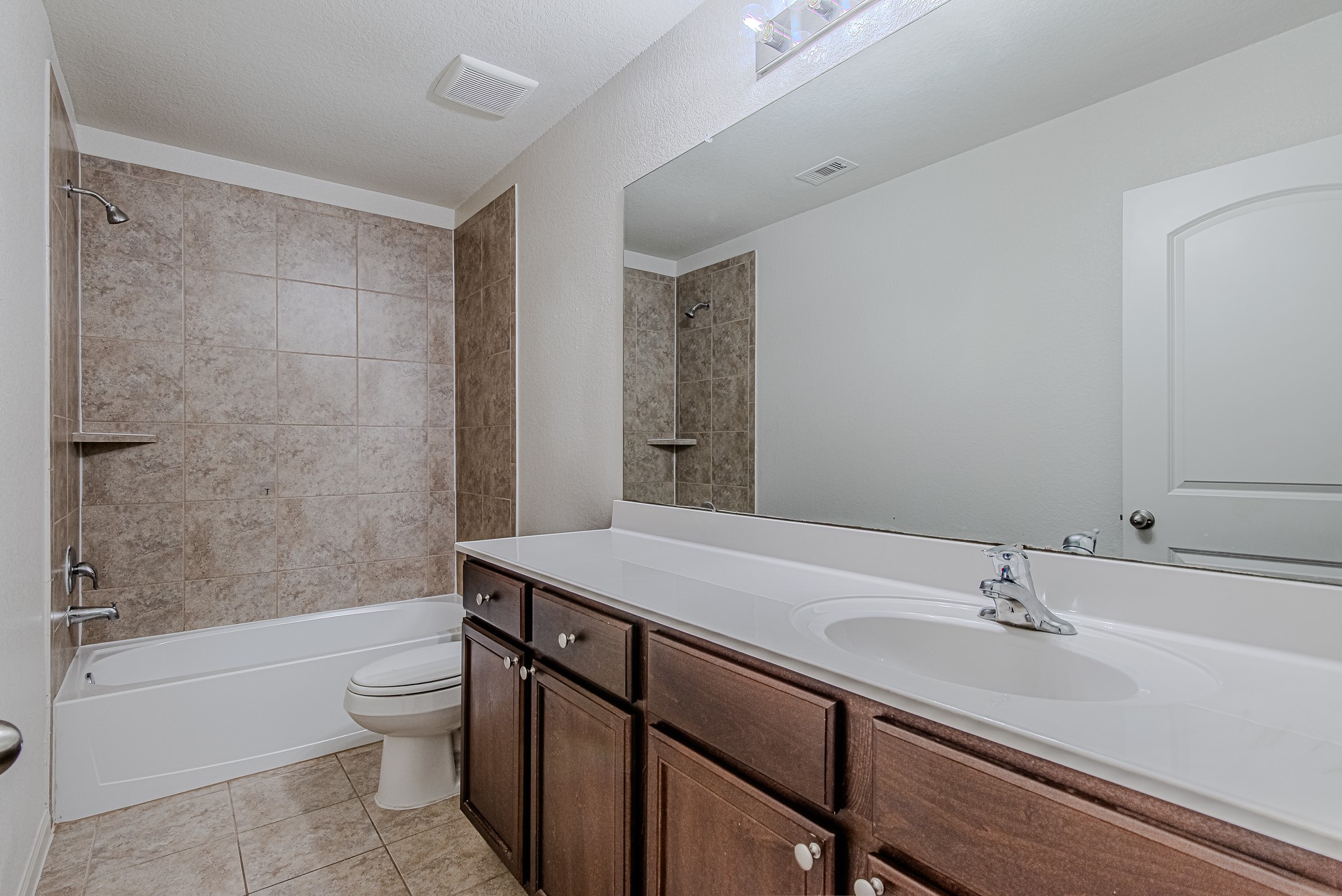 9522 Olive Stone Drive Rosharon, TX 77583 - Photo 25 of 29 a bathroom with a sink a toilet and shower