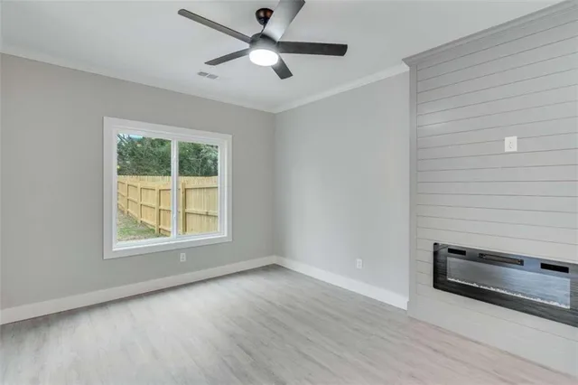 a view of an empty room with a window