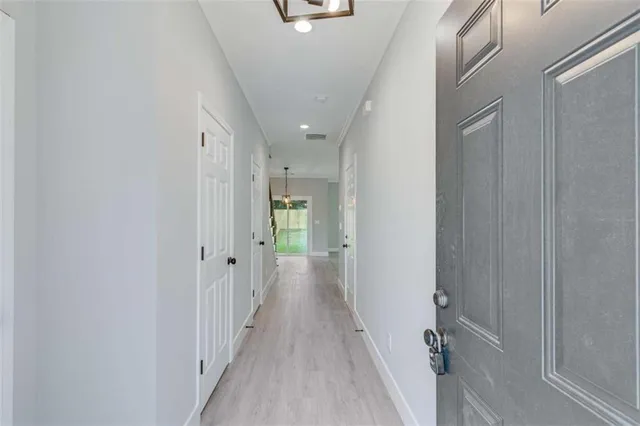 a view of kitchen with microwave and stove top oven