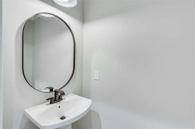 a large white kitchen with lots of counter space wooden floor and appliances