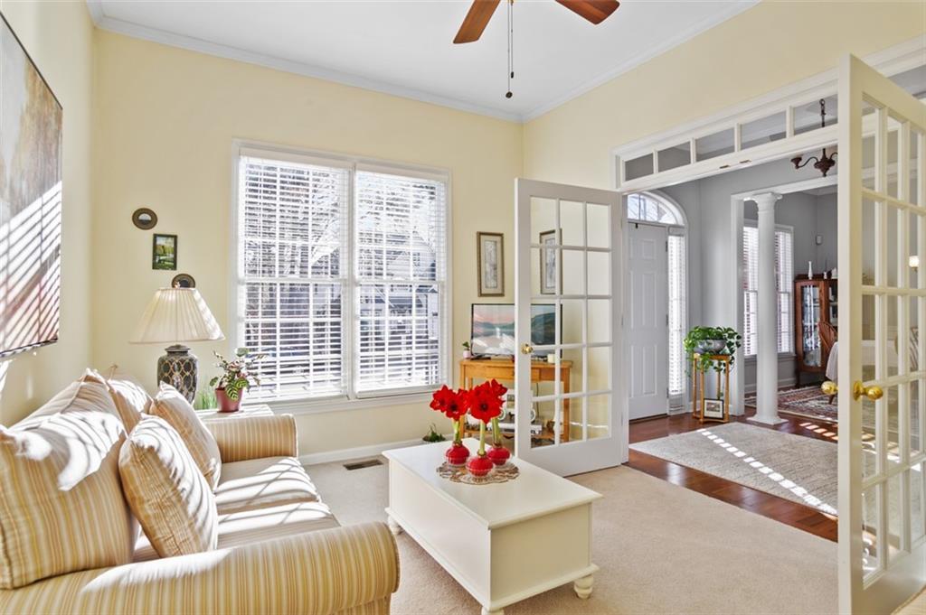 352 Woodbrook Crest Canton, GA 30114 - Photo 11 of 53 a living room with furniture and a large window