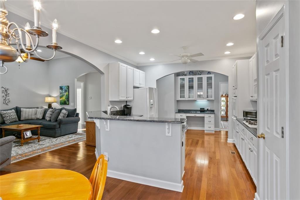 352 Woodbrook Crest Canton, GA 30114 - Photo 13 of 53 a large kitchen with stainless steel appliances granite countertop lots of counter top space