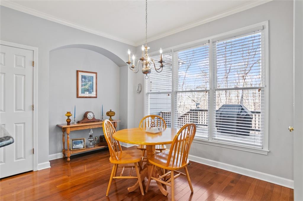 352 Woodbrook Crest Canton, GA 30114 - Photo 16 of 53 a dining room with furniture and window