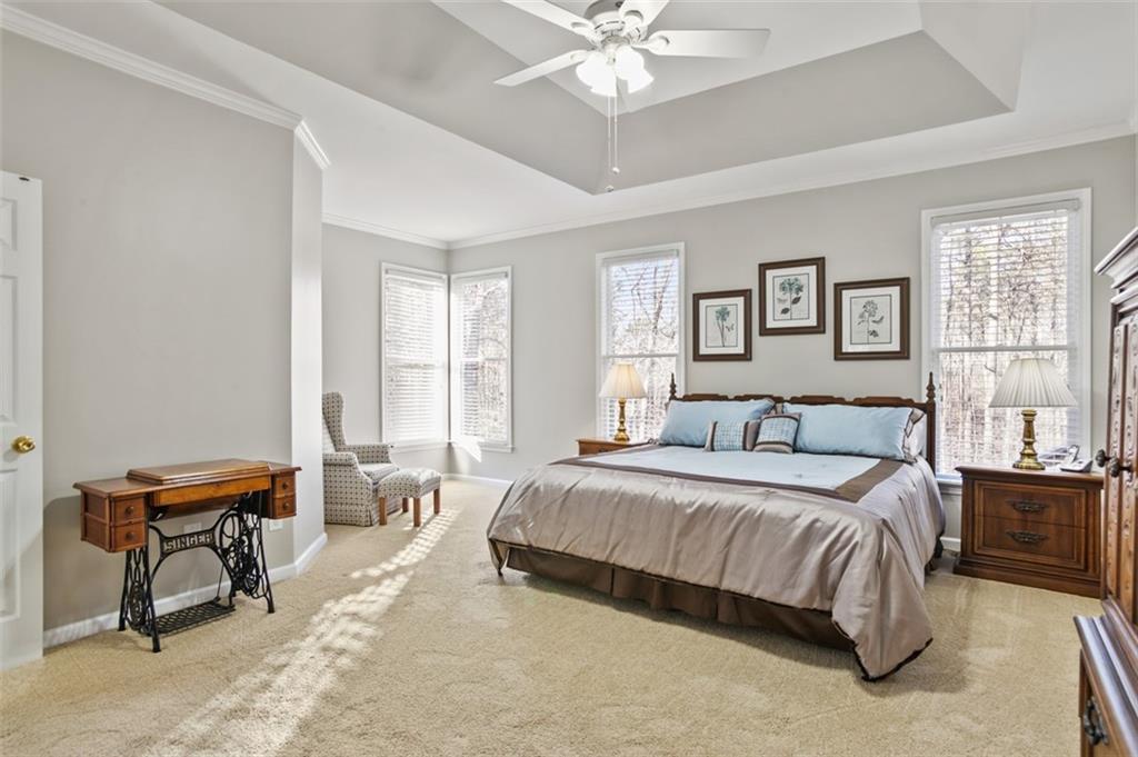 352 Woodbrook Crest Canton, GA 30114 - Photo 17 of 53 a spacious bedroom with a bed and a window