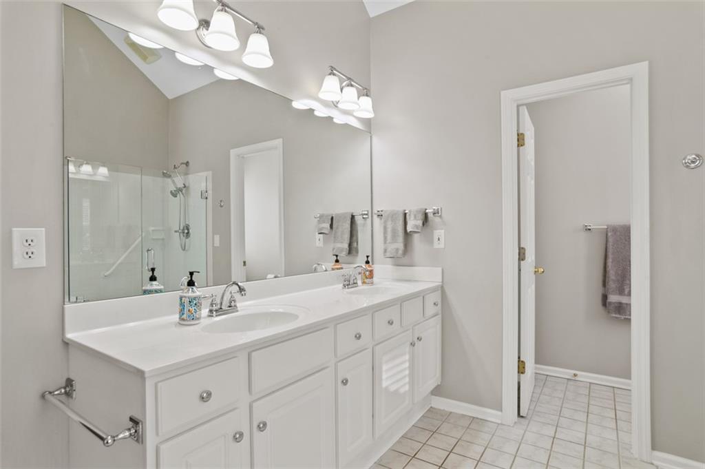 352 Woodbrook Crest Canton, GA 30114 - Photo 20 of 53 a bathroom with a sink double vanity and a mirror