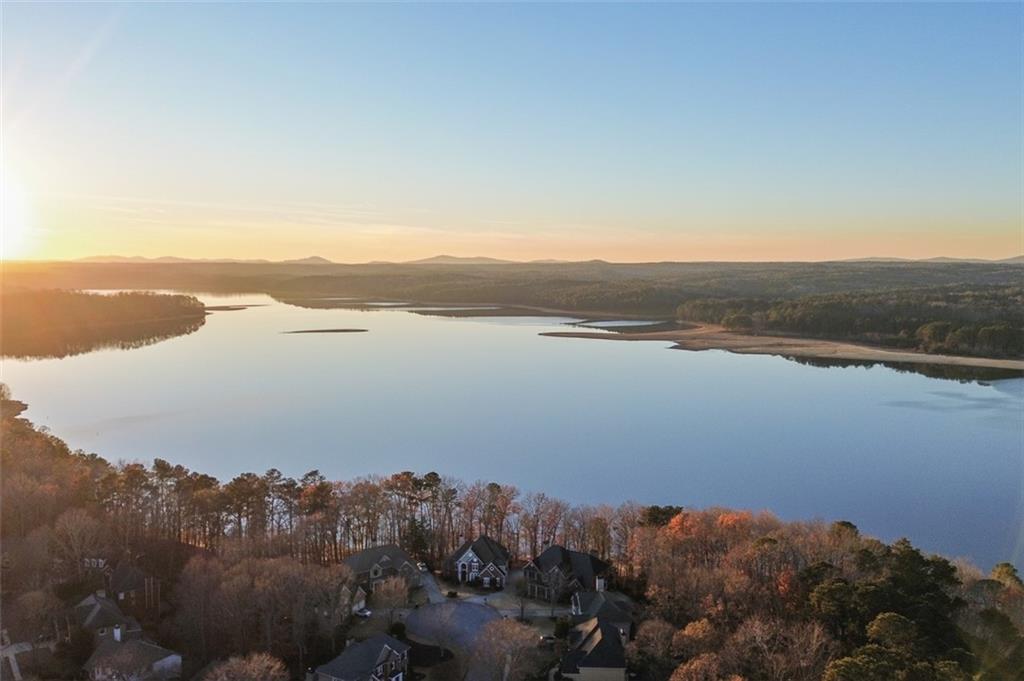 352 Woodbrook Crest Canton, GA 30114 - Photo 2 of 53 a view of lake and mountain