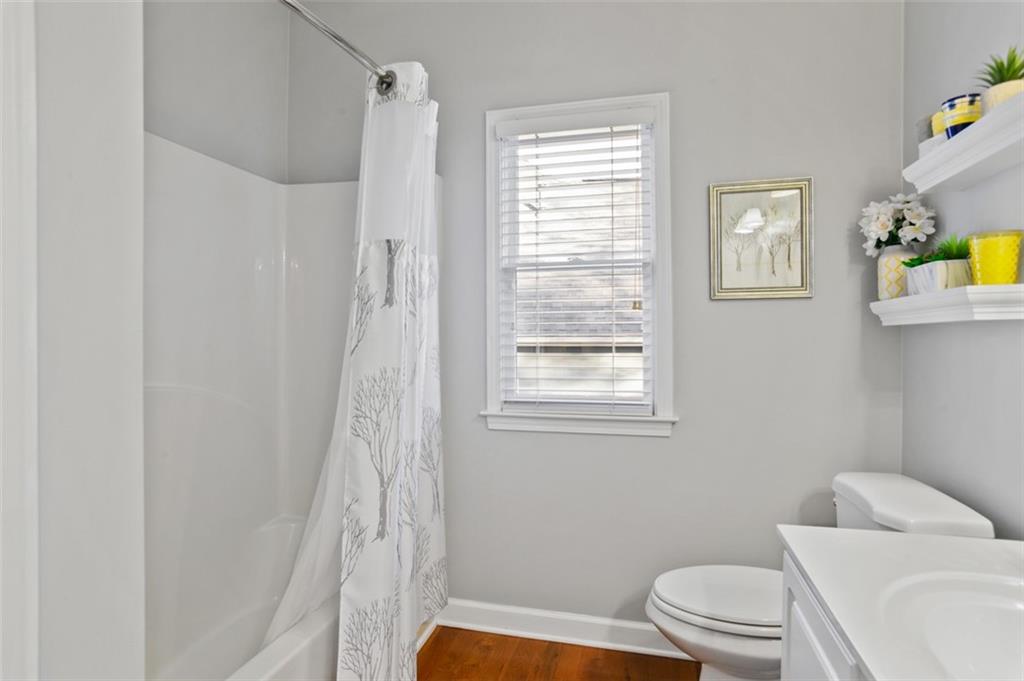 352 Woodbrook Crest Canton, GA 30114 - Photo 27 of 53 a bathroom with a toilet a sink and a shower
