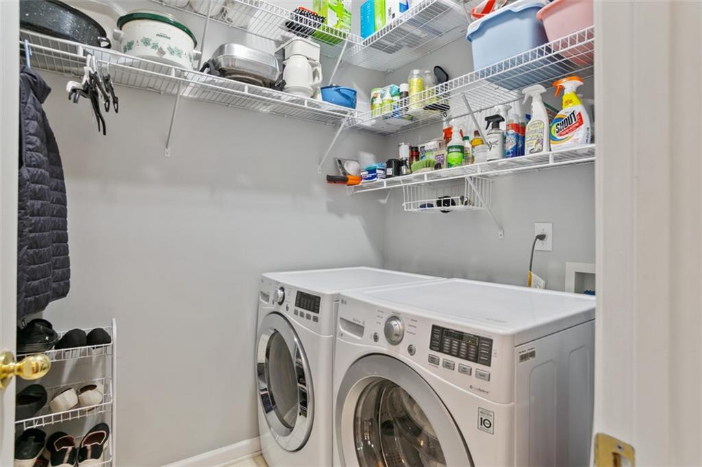 352 Woodbrook Crest Canton, GA 30114 - Photo 30 of 53 a utility room with dryer and washer