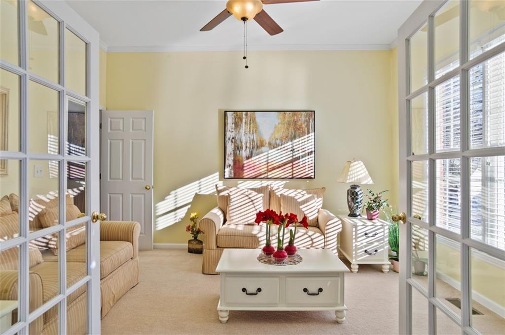 352 Woodbrook Crest Canton, GA 30114 - Photo 3 of 53 a living room with furniture and a floor to ceiling window
