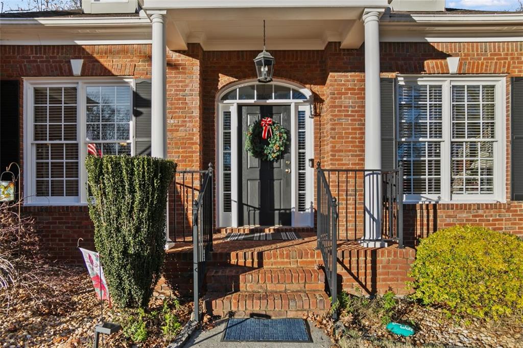 352 Woodbrook Crest Canton, GA 30114 - Photo 38 of 53 a front view of a house with a glass door